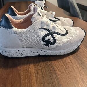 Kate Spade White and Black women’s sneakers.